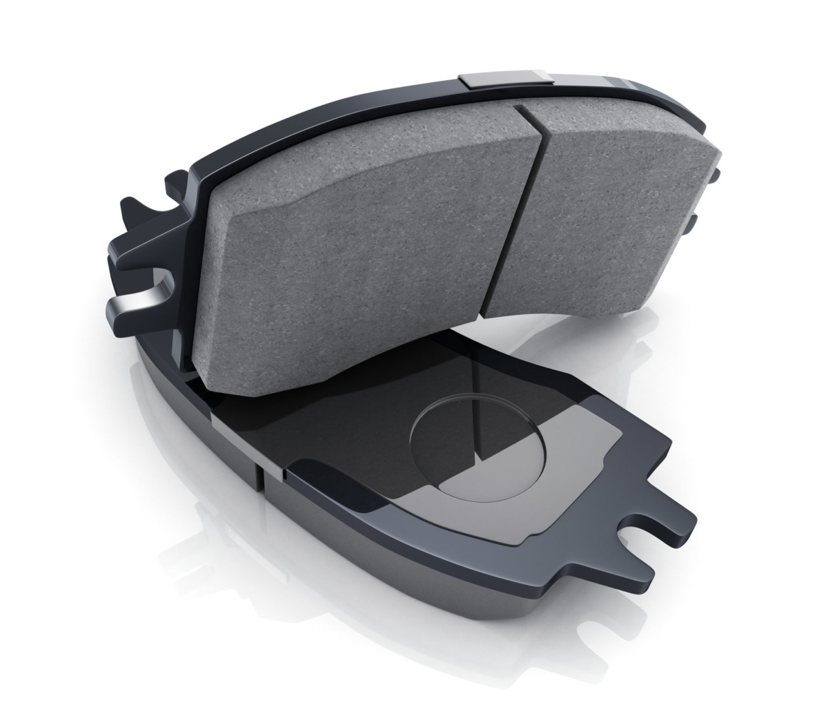 Two black brake pads on white background
