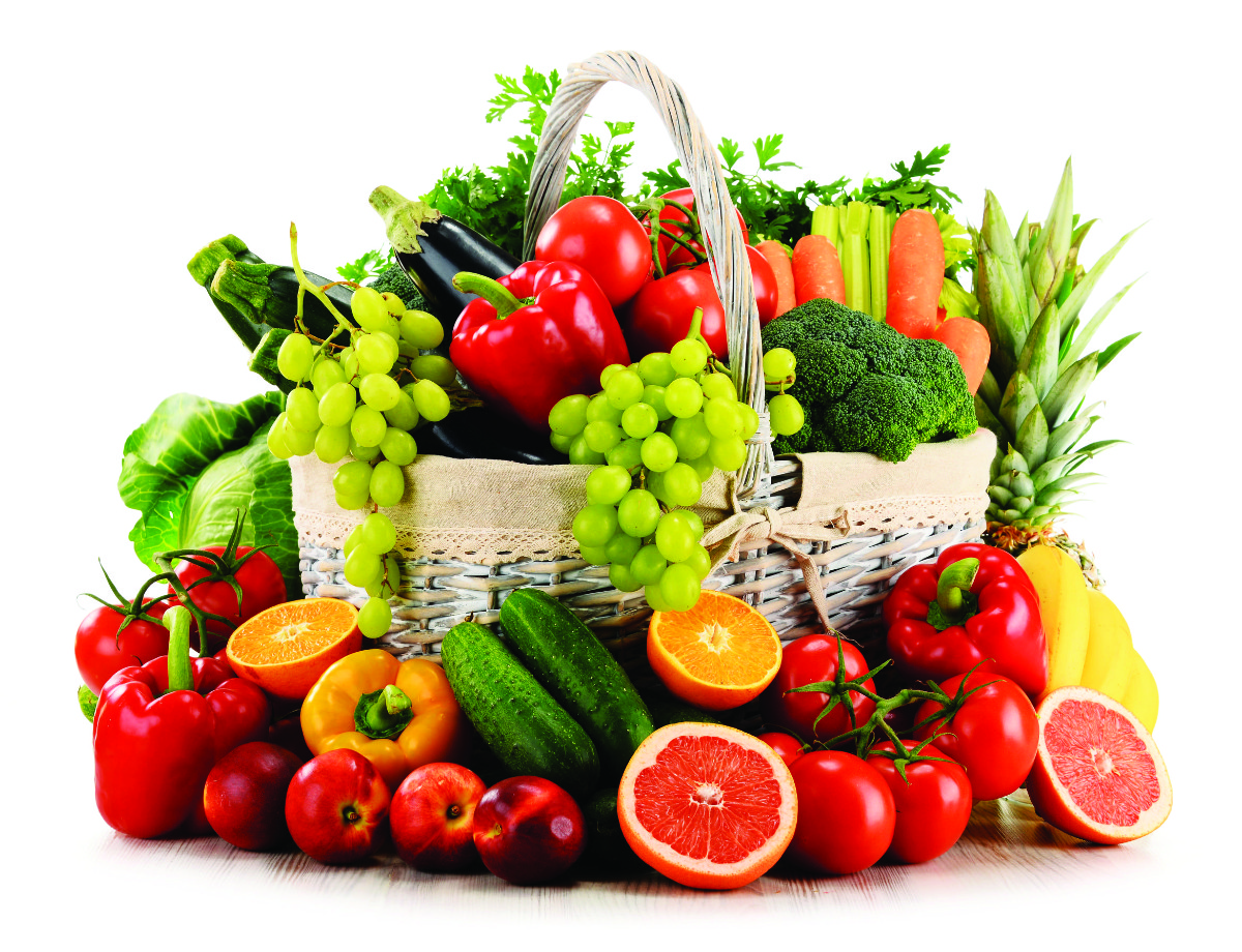 41640832 - variety of organic vegetables and fruits in wicker basket isolated on white